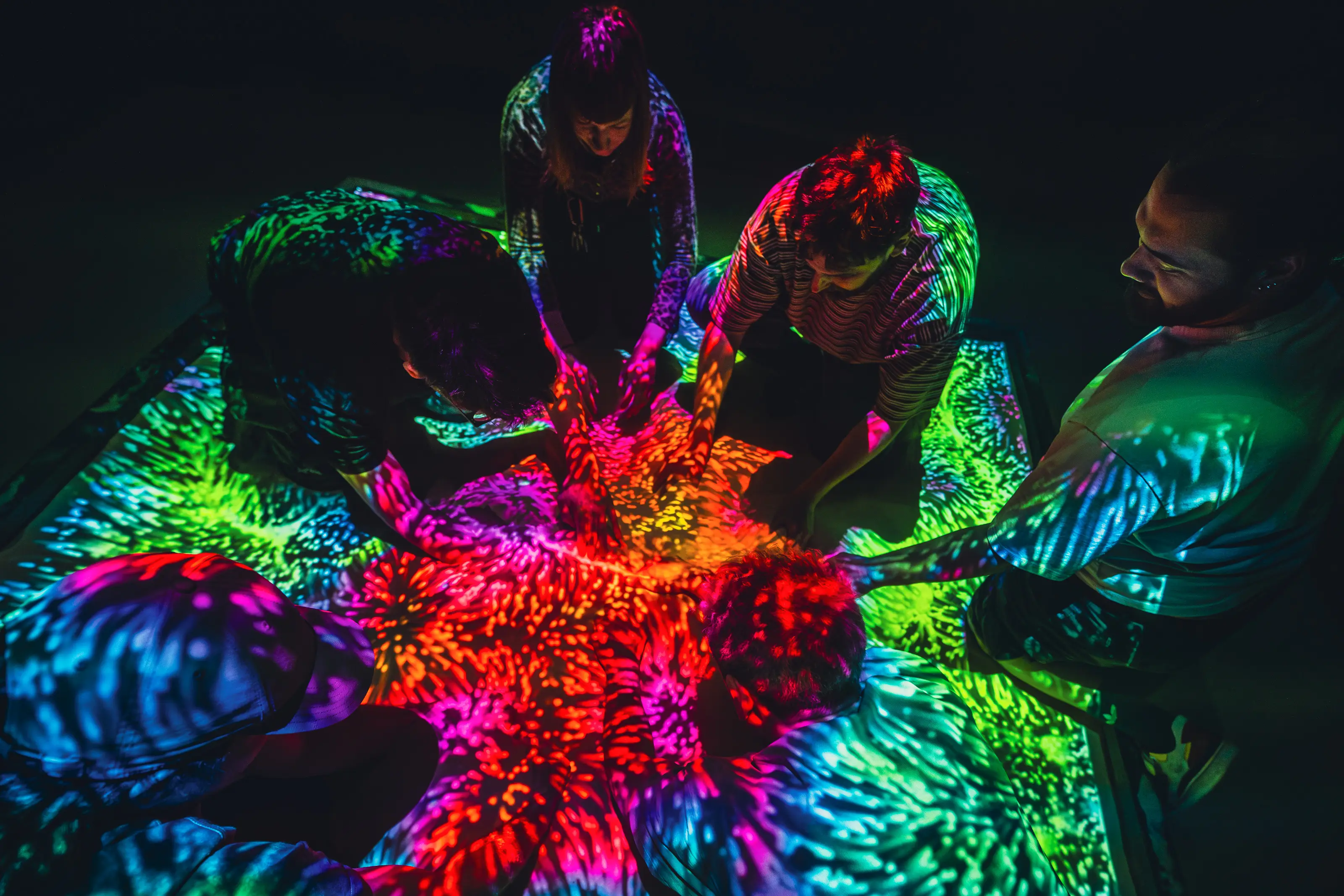 Visitors interacting together inside a SUPERMASSIVE installation