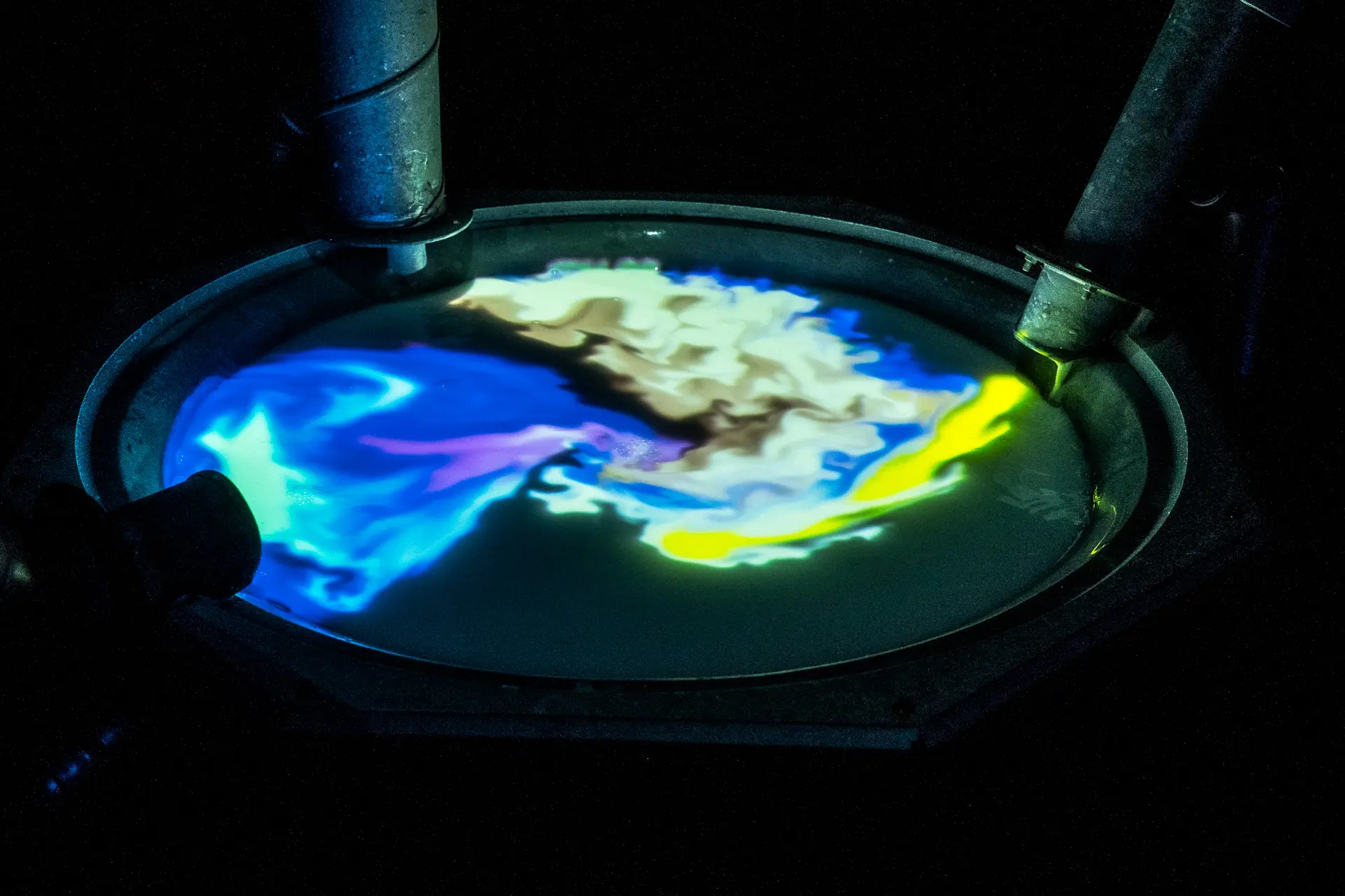 Visitors collaborating at analogue control stations to change the virtual chemical balance