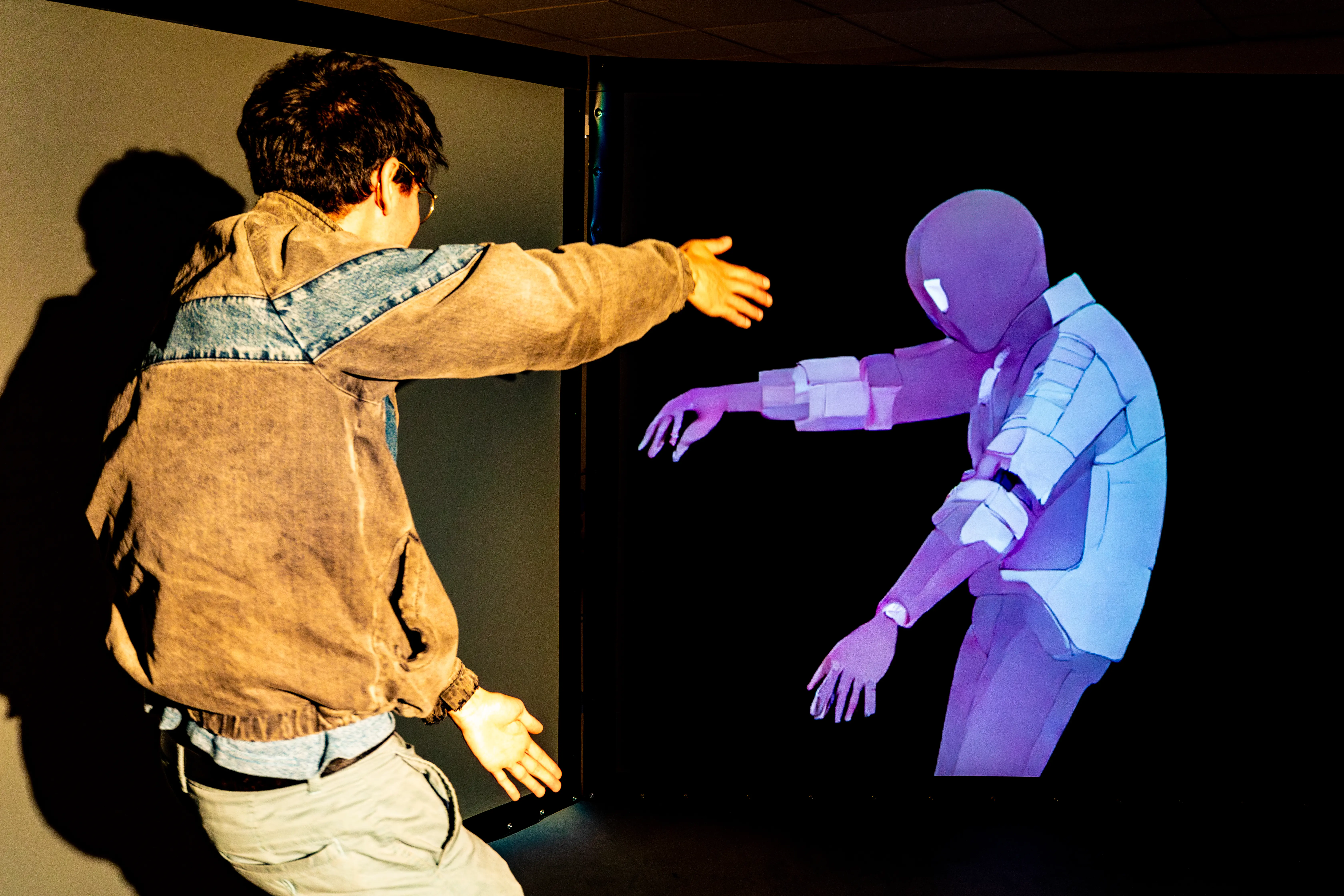 Wide view of the Imagine installation with multiple participants exploring prompt-driven visual transformations