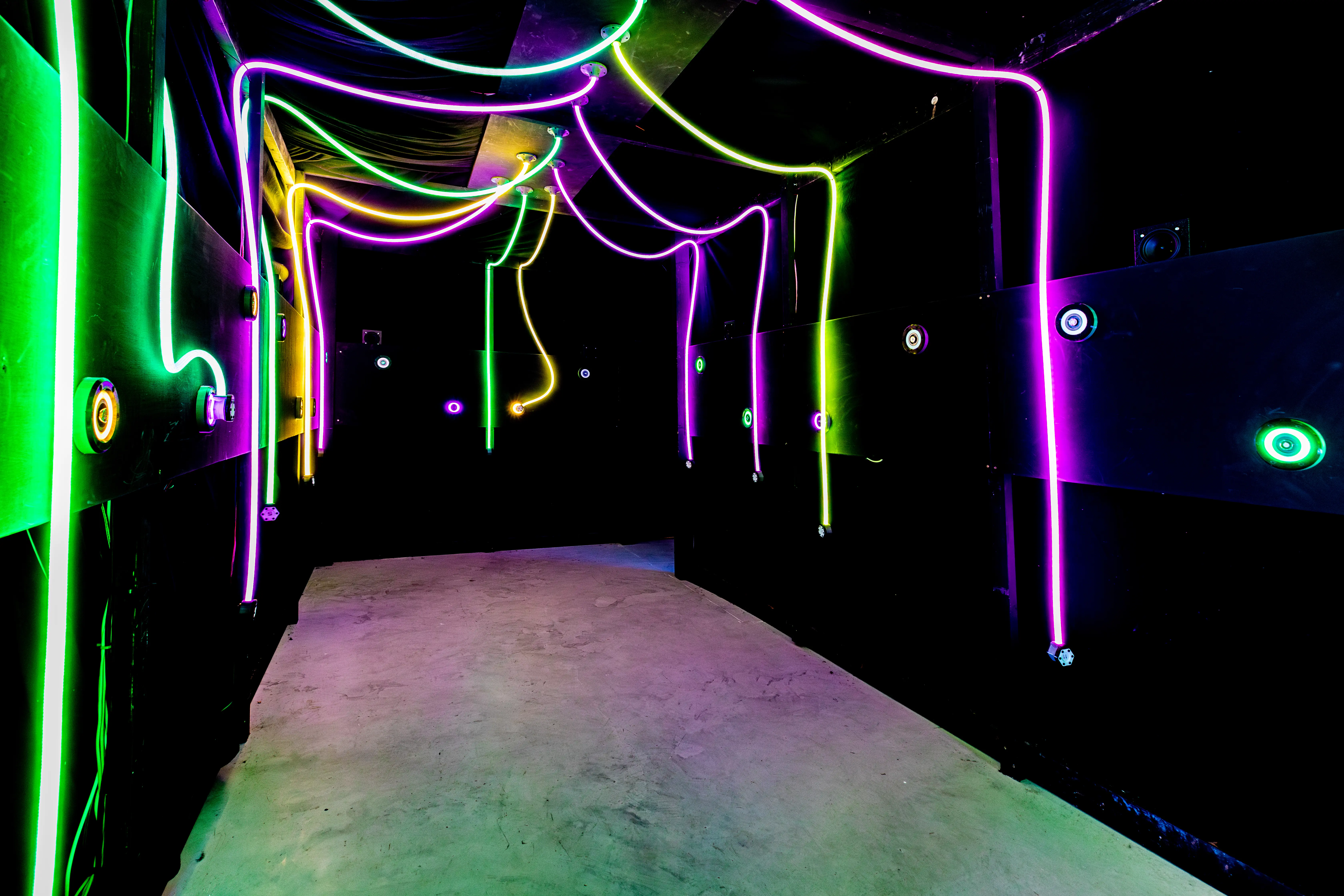 Wide view of the Salford Shopping City residency with visitors exploring interactive digital artworks